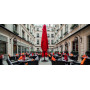 Closed red umbrella in courtyard